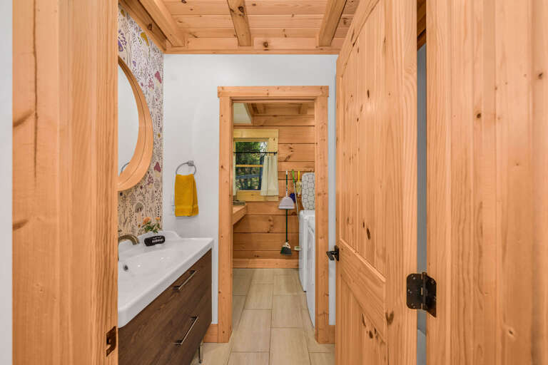 View through half-bath to laundry room