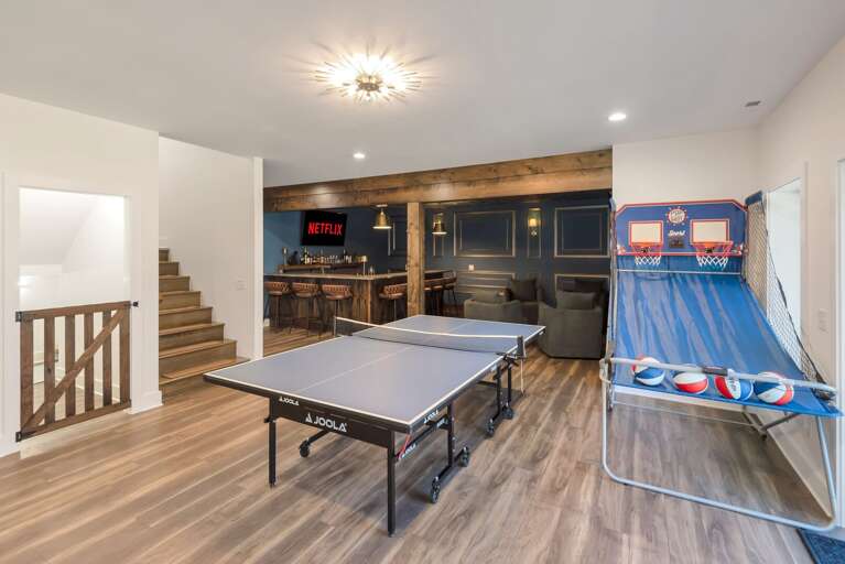 Game room, wet bar, media room, and gated area for dogs...