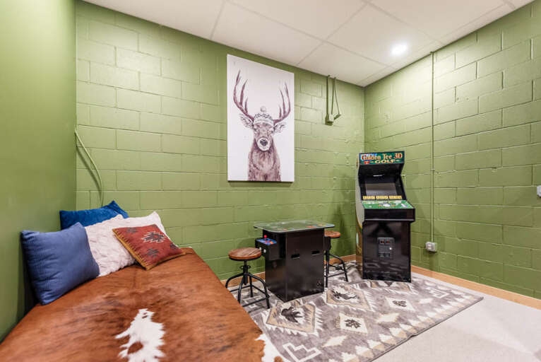 Twin bed in downstairs game room...