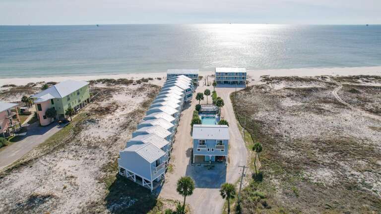 Beachside Buildings Bask Beside Blue Ocean