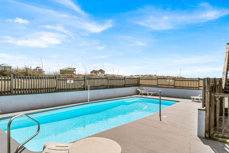 Poolside Paradise, Pristine And Peaceful, Under A Vast, Vibrant Sky