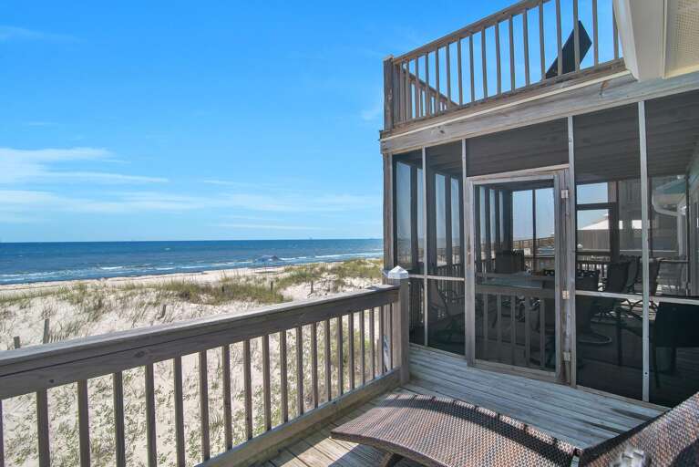 Beachfront Balcony View From Vacation Rental Facing Sea And Sand