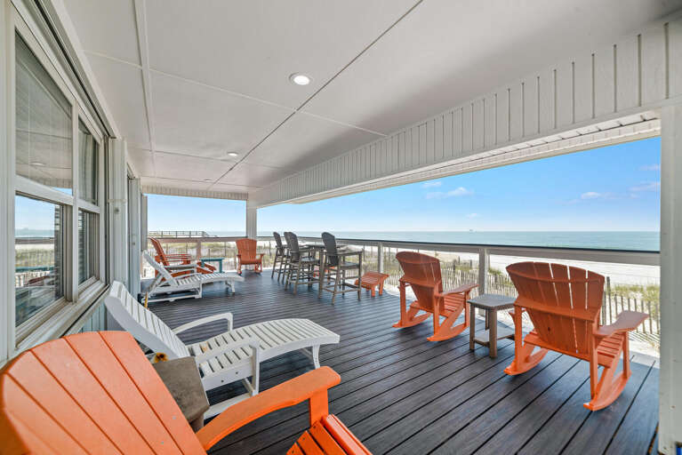 Seaside Deck With Chairs Overlooking Beach