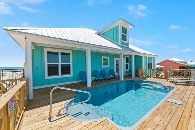 Blue Beach House With Pool On Sunny Day