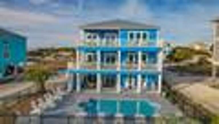 Blue Beachside Vacation Rental With Pool