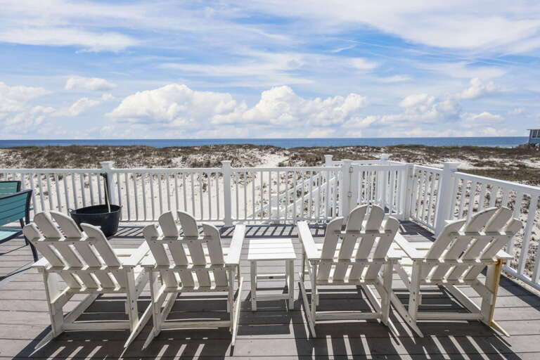 Beachfront Balcony With Chairs Facing The Sea
