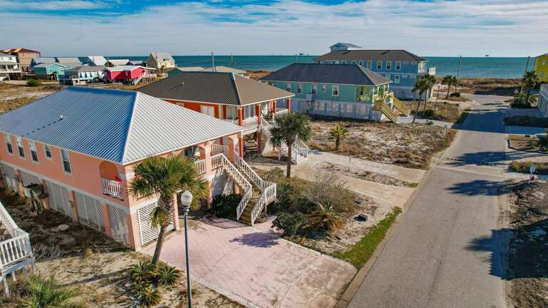 Seaside Street Scene Showcasing Vibrant Vacation Rentals By The Beach
