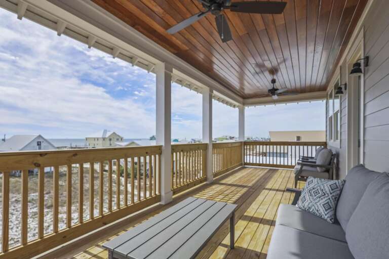 Wooden Waterfront Deck With Seating, Overlooking Beach