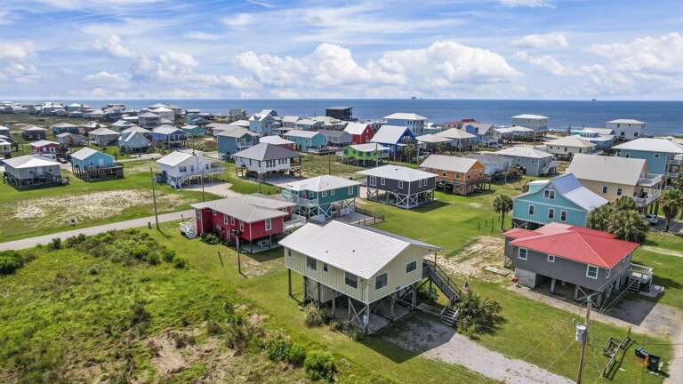 Seaside Structures Scattered Under Sunny Skies