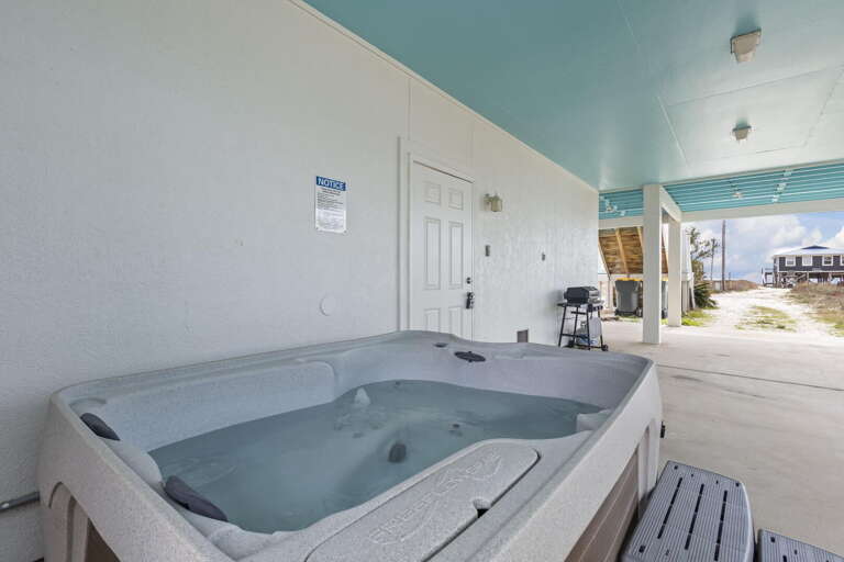 Patio With Jacuzzi Under Breezy Blue Canopy, Bench Beside