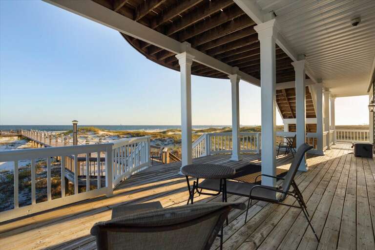 Beachfront Balcony With Chairs Overlooking Dunes