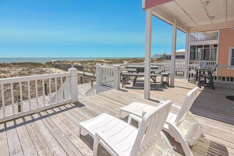 Beachside Deck With Chairs Overlooking Dunes