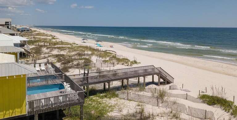 Beachfront Buildings Bordering Breezy Blue Sea