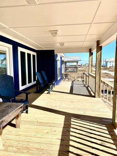 Beachside Boardwalk By Blue Buildings, Bright Balcony Scene
