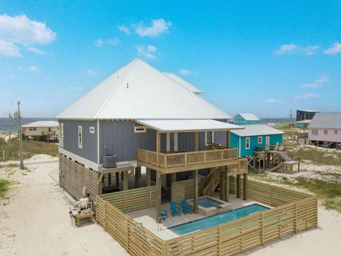 Grey Beach House With Pool, Deck, And Dune Backdrop