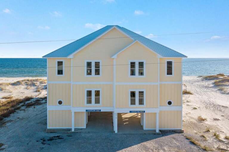 Beachside Building Basking Beside Blue Waters