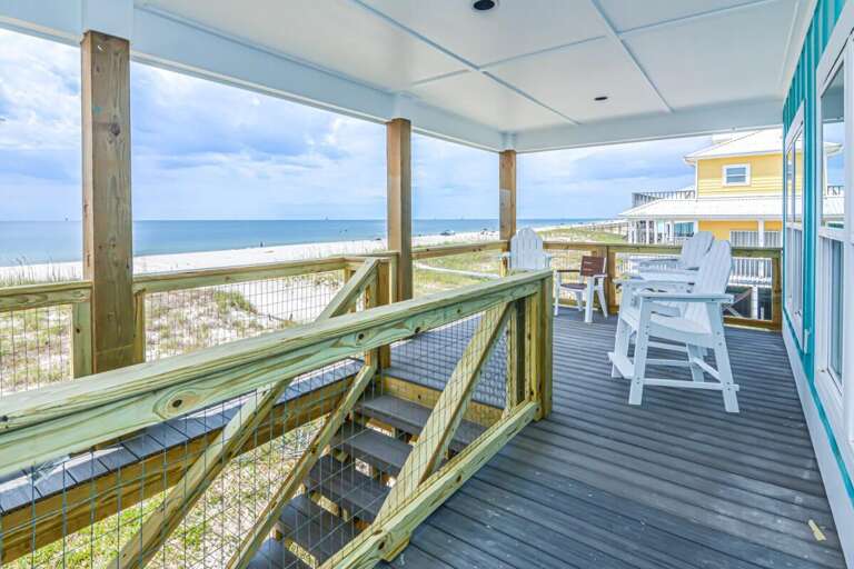 Beachfront Balcony View With Seating Overlooking The Sea