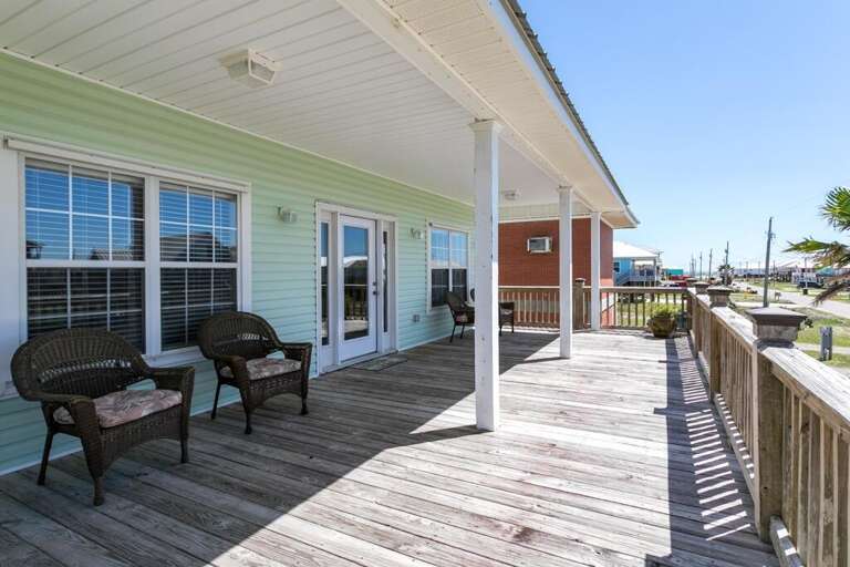 Pastel Beach House With Breezy Boardwalk And Bench Seating