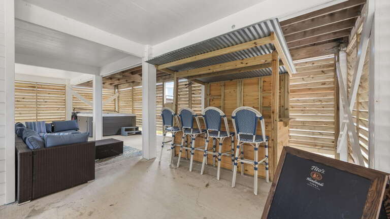 Spacious Patio Area With Seating And Sectional Sofa Under Slatted Wood Cover