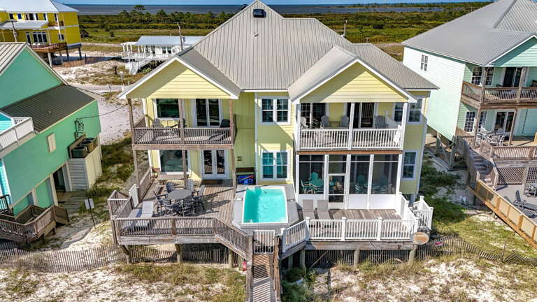 Beachfront Building Bordered By Similar Structures, Hosting Balconies And A Pool