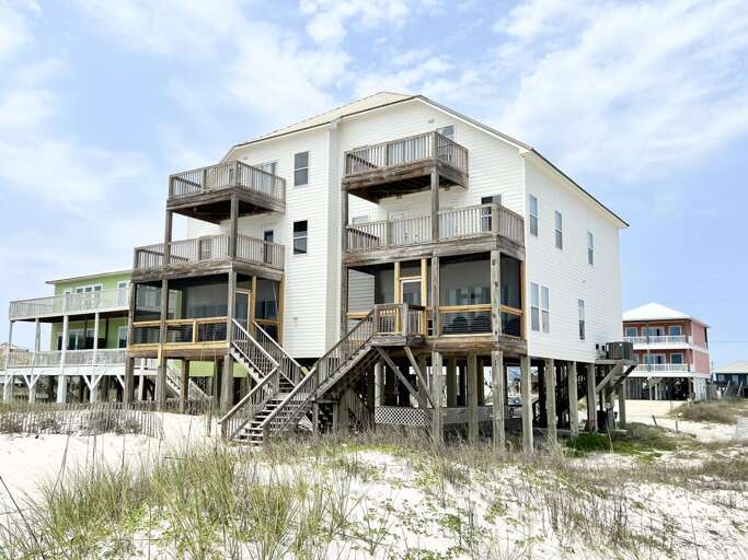 Three-tiered Beachside Building Beside Soft Sands
