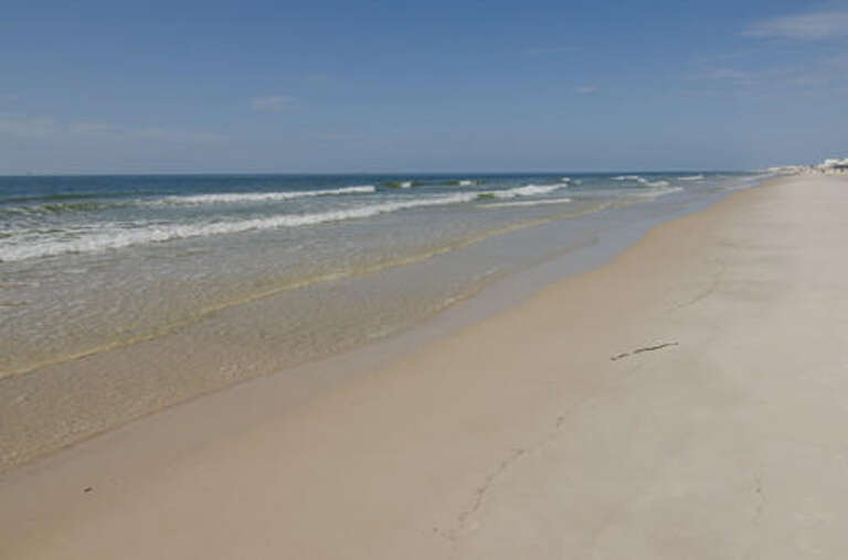 Beach area in front of house