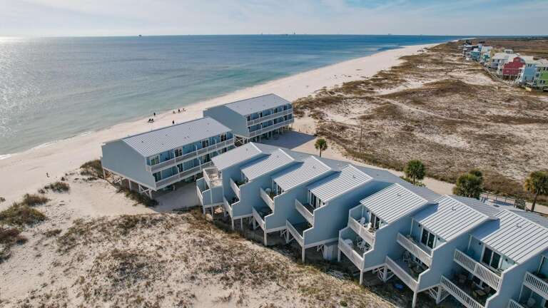 Seaside Structures Sand-side, Serene Sea Beyond
