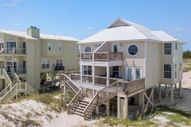 Beachfront Vacation Rental With Balconies And Stairs