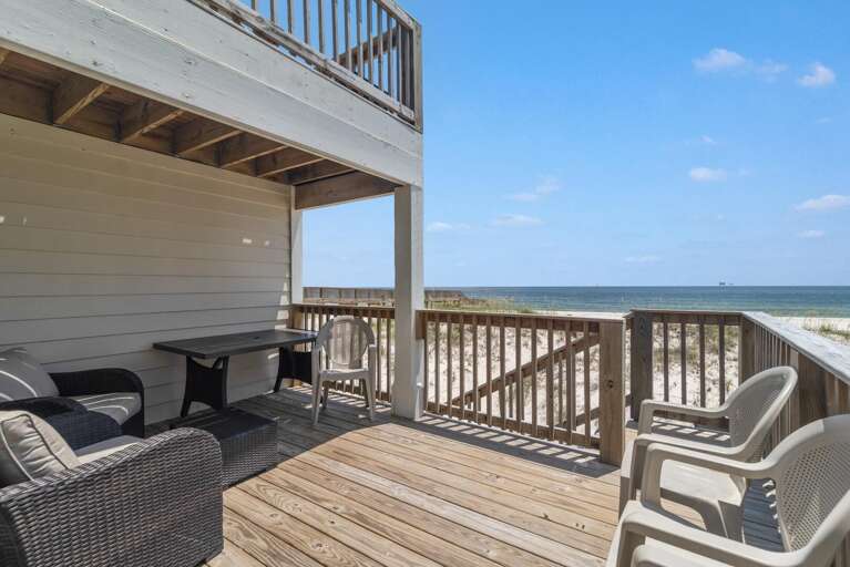 Beachfront Balcony With Chairs Overlooking The Sea
