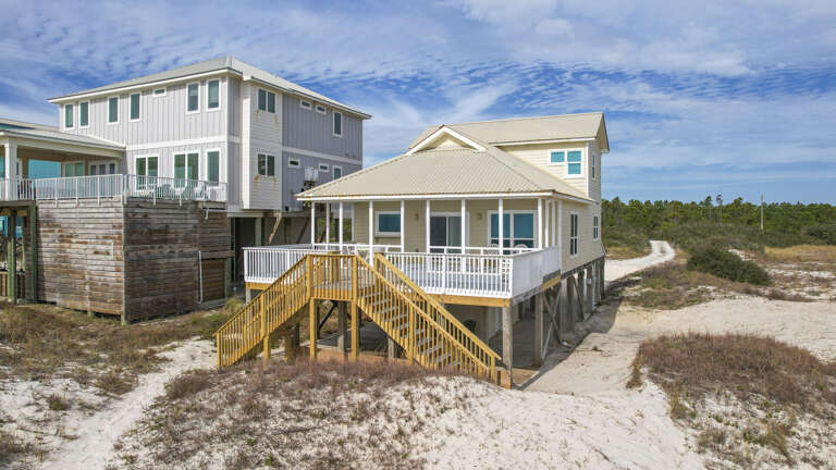 Beachside Buildings Beside Barren Dunes