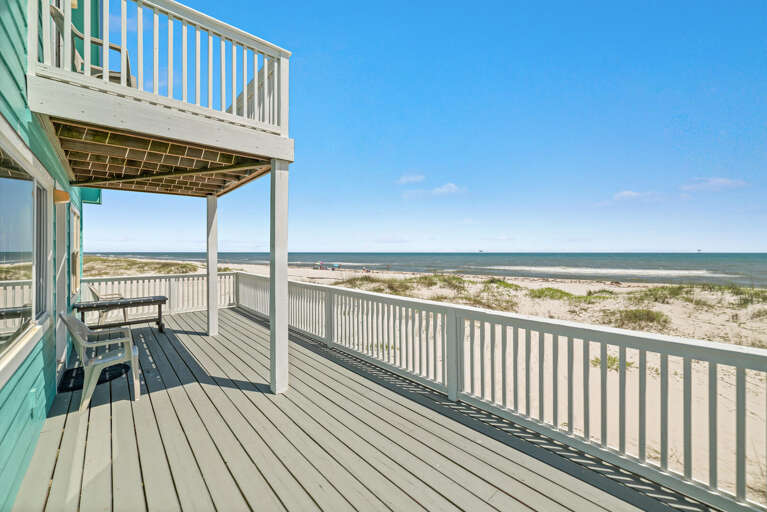 Wooden Deck Beside Beach Under Bright Blue Sky