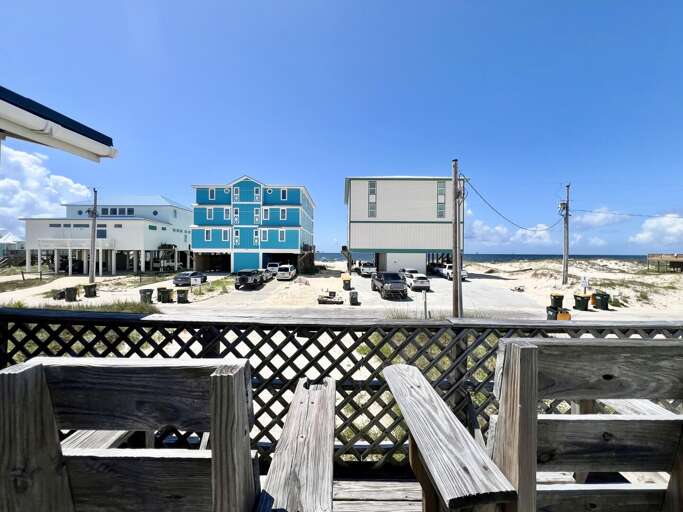 Beachfront Buildings Beneath Blue Skies, Boardwalk Barrier