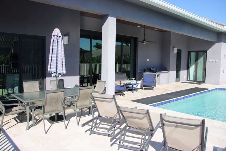 Poolside Patio, Loungers Lined Leisurely, Clear Sky
