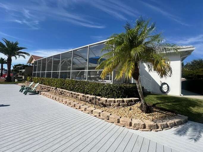 Palm-fringed Poolside Pavilion Under Blue Skies