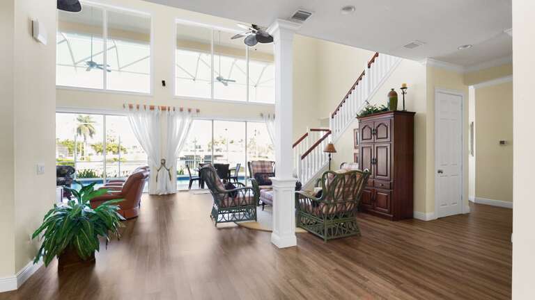 Spacious Suburban Sitting Space With Sweeping Staircase